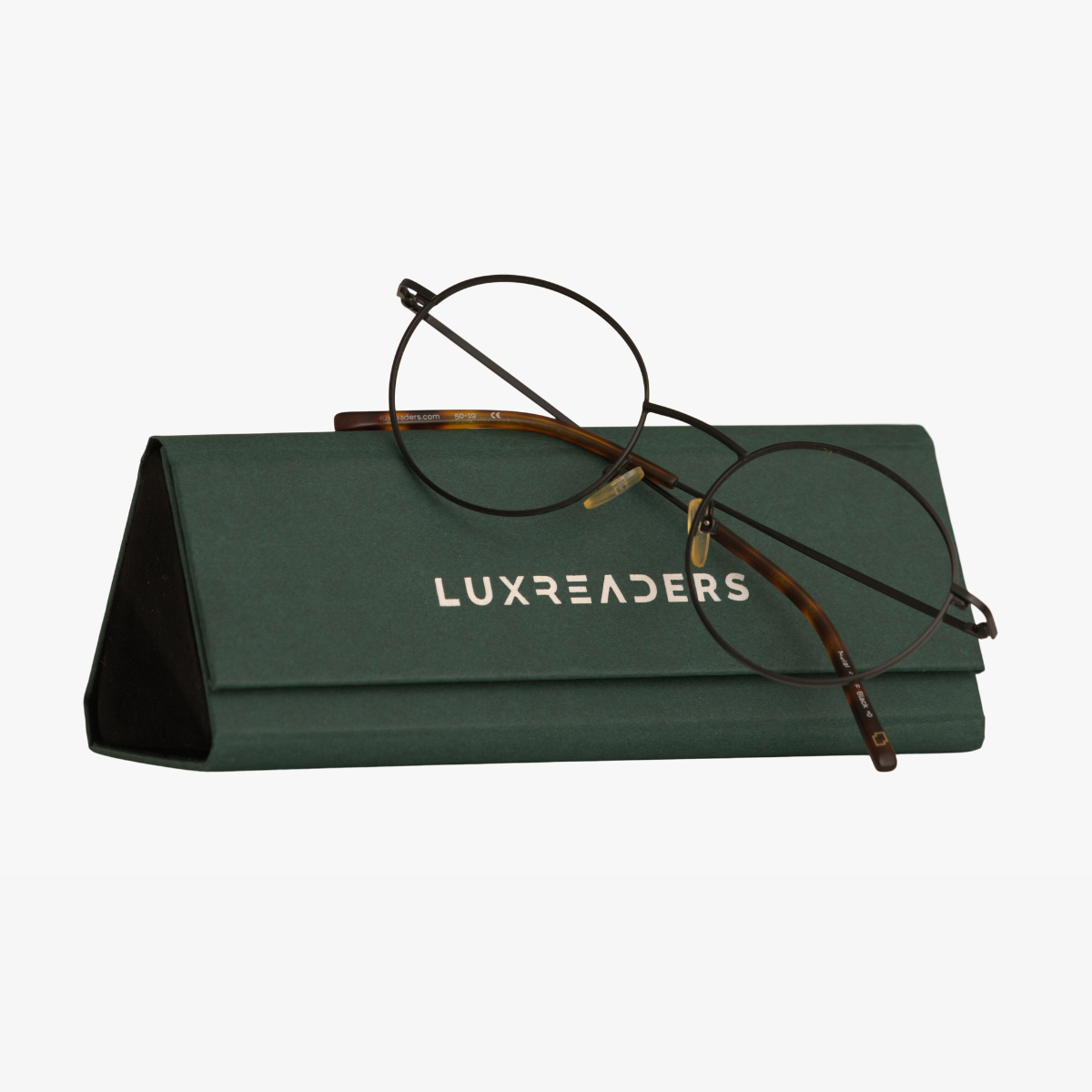 Round wire glasses on green Luxreaders hard case