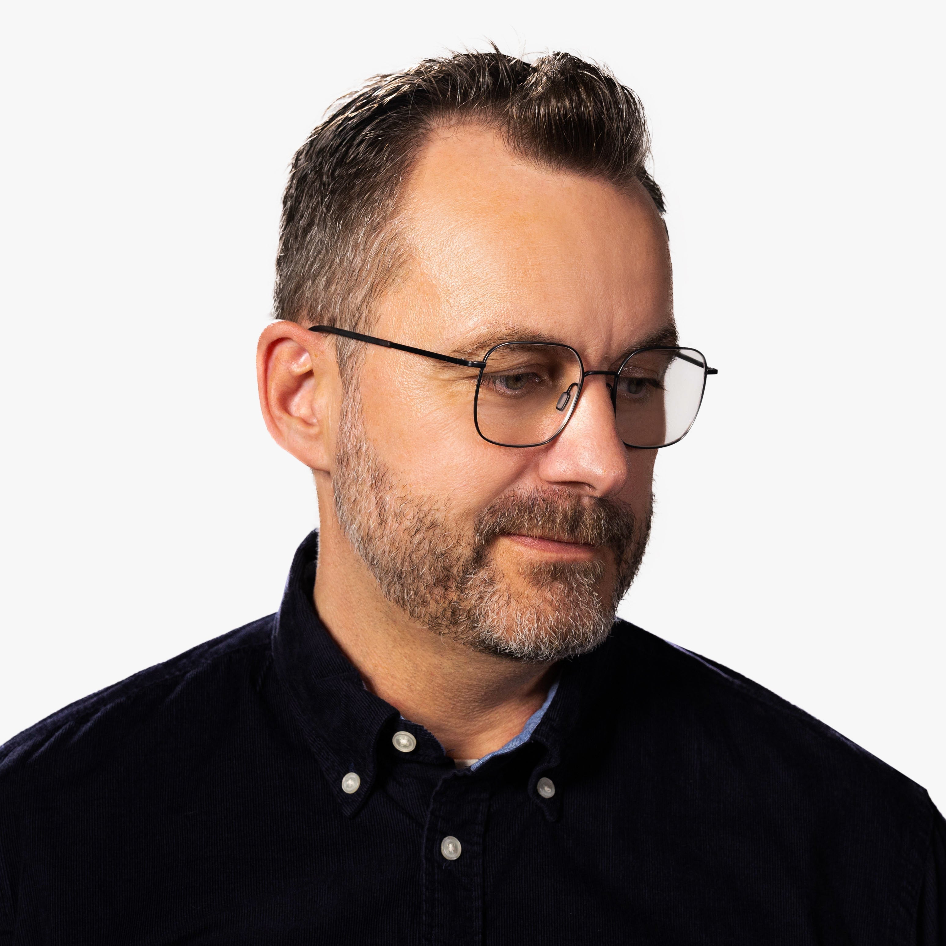 Person wearing Men's Båstad Gun glasses with thin metal frame