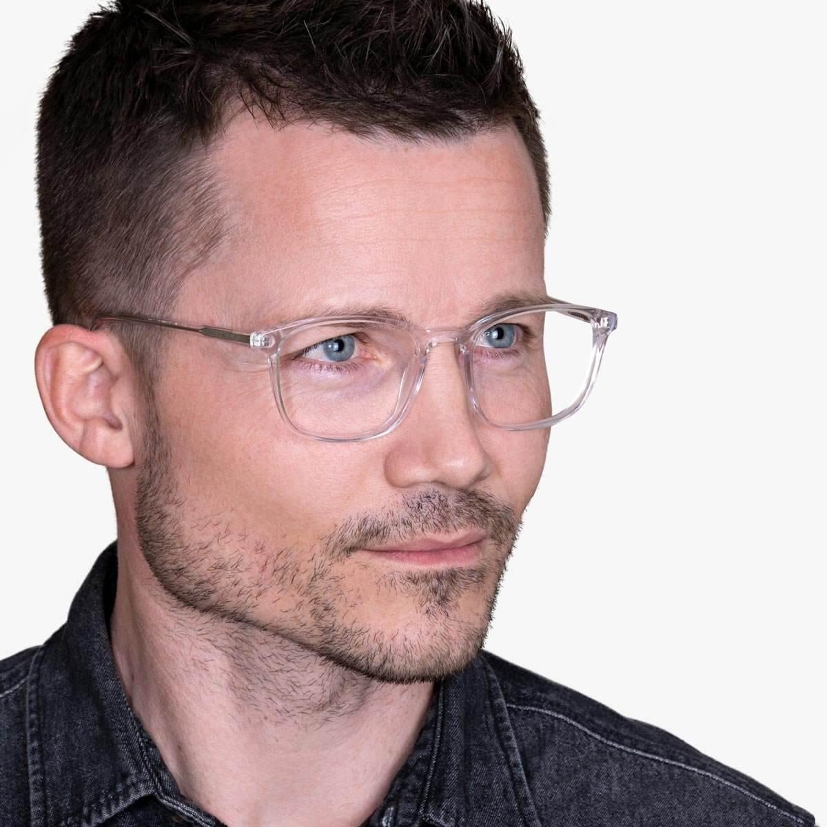 Person wearing Men's Ebeltoft Crystal White glasses