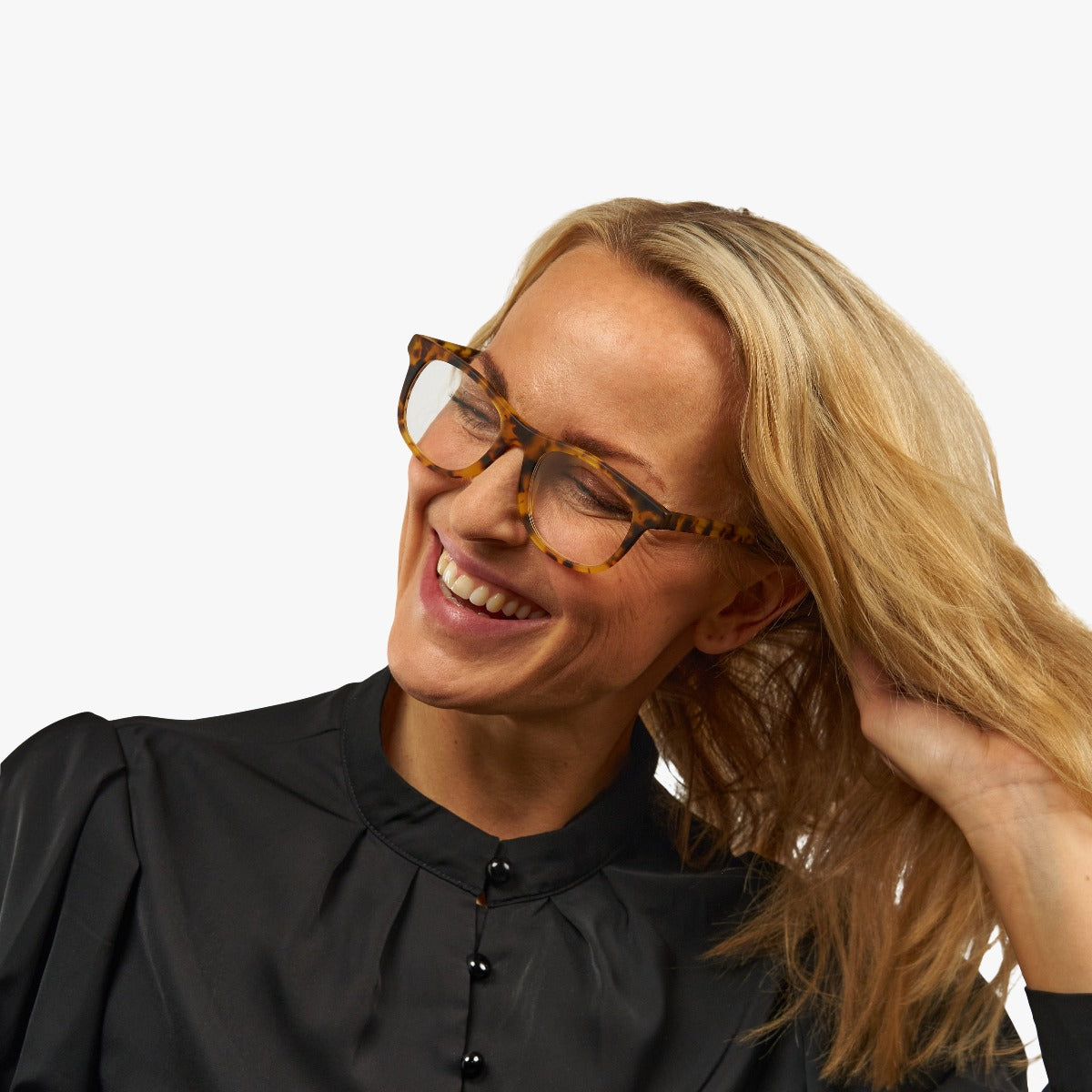 Person wearing tortoiseshell reading glasses