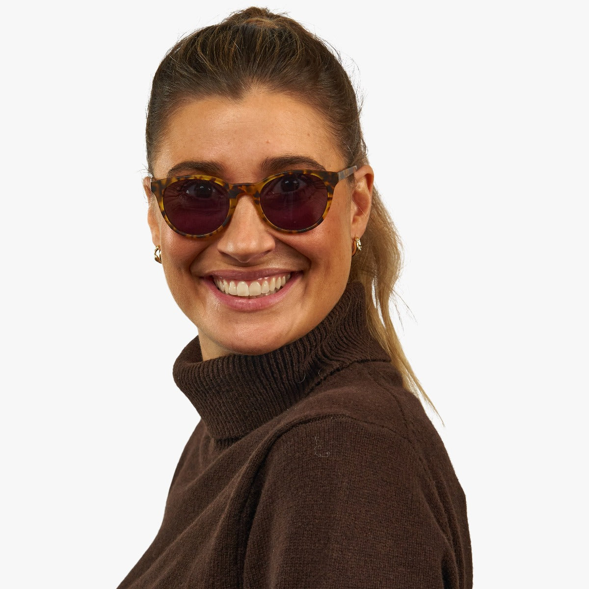 womens-orebro-light-turtle_sunglasses_female-model-1.jpg?v=1771420132&width=1200