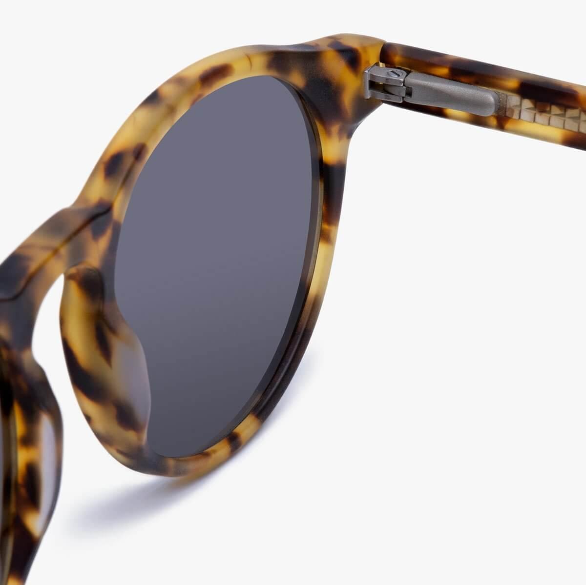 Tortoise shell sunglasses with round lenses and sleek design